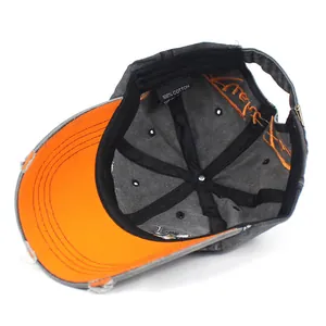 Washed cotton baseball cap with vintage finish, eagle embroidery and contrast orange brim