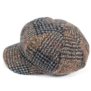 Close-up of retro plaid newsboy cap in brown and black wool-blend tweed fabric