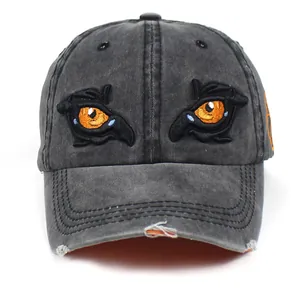 Distressed charcoal grey washed cotton baseball cap with orange eagle eye embroidery
