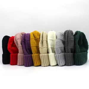 Women's knitted beanies in 10 assorted colors featuring a classic ribbed cuff design