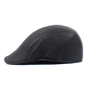 Detail showing reinforced stitching and matte leather texture on black newsboy cap