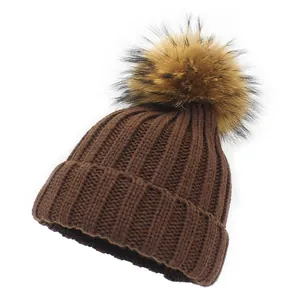 Dark brown ribbed knit winter hat for kids with soft faux fur pom-poms on top