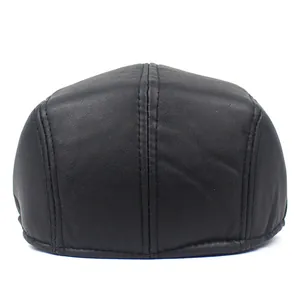 Detail view of the stitching and multi-panel structure on a black PU leather beret hat