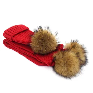 Red knit hat and scarf set with three fluffy faux fur pom-poms for kids winter warmth