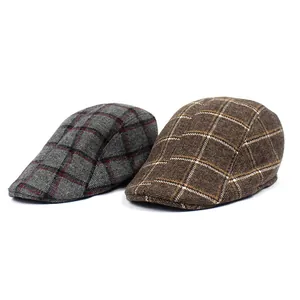 Detailed close-up of retro plaid cotton ivy caps in grey and brown for men