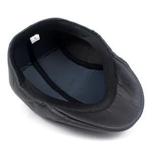 Internal structure of black PU leather ivy cap featuring size 58 label and quilted lining