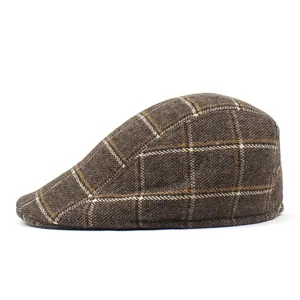 Close-up of brown plaid wool texture and side profile of a vintage flat cap