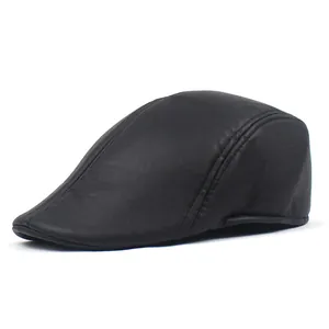 Detailed view of black PU leather flat cap showing fine texture and reinforced double stitching