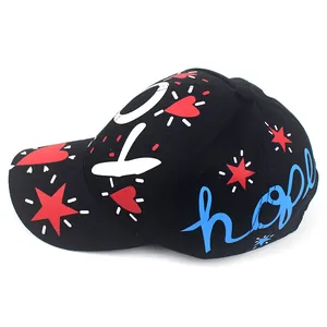Detail of a black cotton baseball cap with colorful LOVEJOY graffiti and hope embroidery