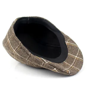 Classic brown plaid flat cap for men featuring a vintage newsboy style in autumn cotton