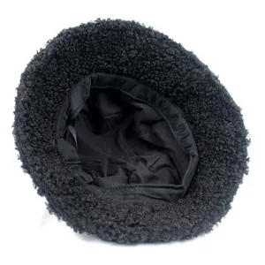 Women's black teddy fleece bucket hat for winter featuring soft lamb wool texture
