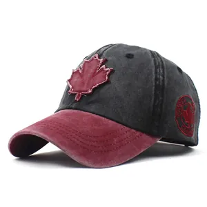 Detail of washed cotton baseball cap with maple leaf patch and Canada side embroidery