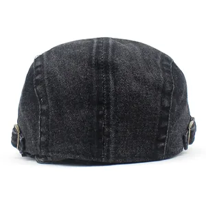 Rear view of washed black denim ivy cap with vintage adjustable brass side buckles