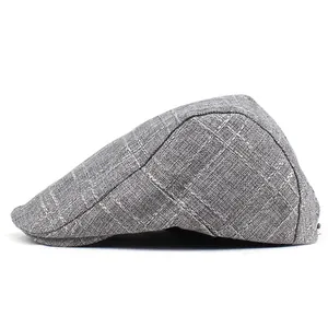 Detail of grey plaid beret showing breathable linen fabric texture and sleek side profile