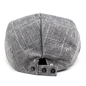 Classic grey checkered cotton beret with adjustable back straps and vintage metal snaps