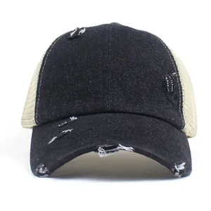 Distressed black denim trucker hat with mesh back and ponytail hole for women