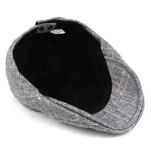 Classic men's grey cotton beret flat cap with vintage striped texture on white background