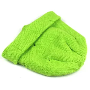 Detail showing neon green distressed knit beanie with ribbed texture and ripped accents