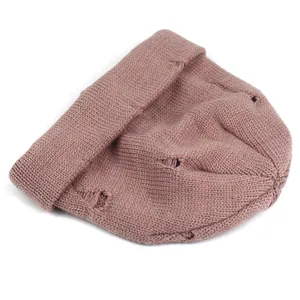 Detailed view of the distressed knit texture and cuff of the dusty pink beanie hat