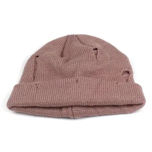 Distressed mauve pink ribbed knit beanie hat for winter outdoor warmth and style