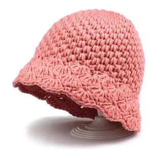 Handmade pink knitted bucket hat for women with wavy brim pattern and thick cozy texture