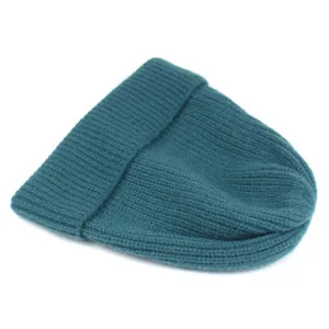 Detail shot of the ribbed knit texture and cuffed hem on a teal winter beanie hat