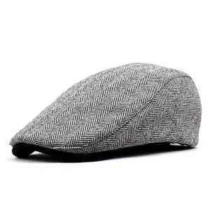Side view of retro wool blend flat cap featuring grey herringbone texture and black brim