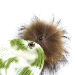 Tie-dye knitted beanie for women with a detachable large faux fur pompom and metal snap