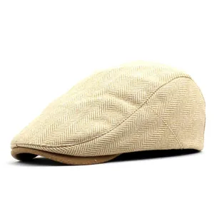 Detail of vintage beige cotton wool ivy cap featuring clear herringbone weave pattern
