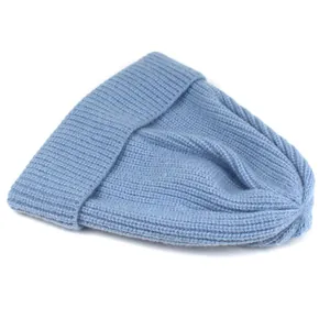 Detailed view of the vertical ribbed knit texture on a soft foggy blue beanie hat