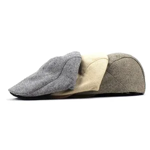 Classic men's herringbone newsboy caps in dark grey, beige, and tan colors