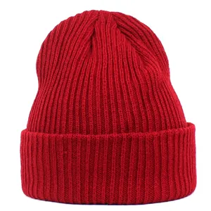 Detailed view of red acrylic ribbed knit beanie with classic fold-over cuff design