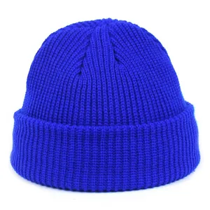 Detail of bright blue ribbed knit texture and cuff on a minimalist acrylic beanie