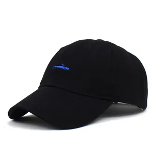 Detailed close-up of blue fish embroidery on a black cotton baseball cap
