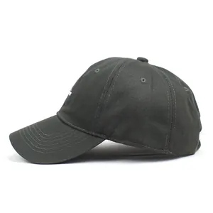 Close-up of the dark grey baseball cap showing embroidery detail and breathable eyelets