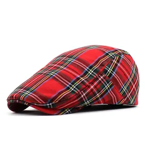 Close-up of the classic red tartan pattern and thick woven texture on the British ivy cap