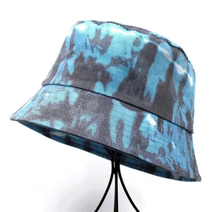 Fashionable blue and grey tie-dye bucket hat for women on a professional display stand