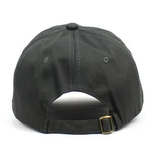 Detail of adjustable metal buckle and cotton fabric texture on dark grey baseball cap