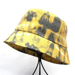 Stylish yellow tie-dye bucket hat for women with sun protection and foldable cotton fabric