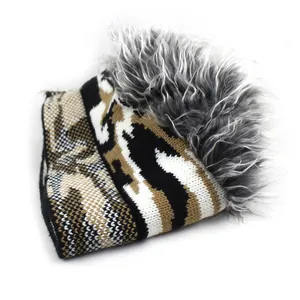 Knit beanie with camouflage pattern and fluffy faux fur pompom for winter outdoor warmth
