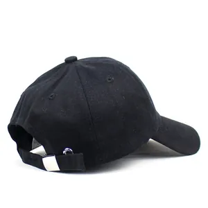Minimalist black cotton baseball cap with adjustable metal buckle on back profile