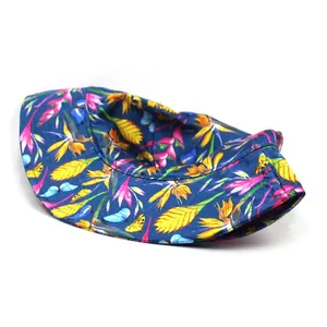 Deep blue silk-like bucket hat with tropical floral print and birds for sun protection