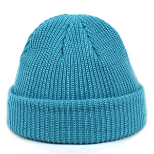 Detailed view of lake blue knit beanie featuring thick ribbed texture and wide cuffed brim