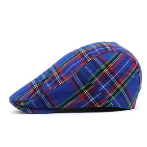 Close-up of blue plaid pattern and fine weaving texture on British style flat cap