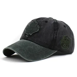 Detail of washed cotton baseball cap featuring maple leaf patch and Canada side embroidery