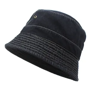 Washed denim bucket hat in dark blue with contrast white stitching and metal eyelets