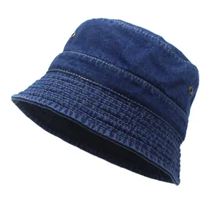 Detail of dark blue denim bucket hat showing metal eyelets and reinforced stitching