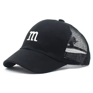 Side view of kids' black mesh baseball cap with white embroidered m letter and mesh back