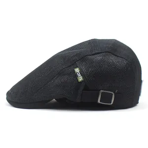 Close-up of black mesh ivy cap with green SPORTS label and adjustable silver metal buckle