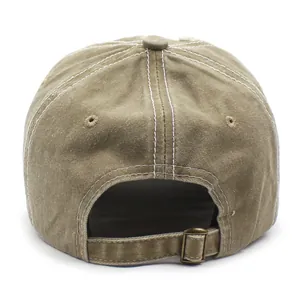 Vintage khaki brown washed cotton baseball cap with adjustable metal buckle and contrast stitching
